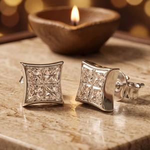 925 silver square kite studs set with princess-cut cubic zirconia, beside a lit diya - earrings category