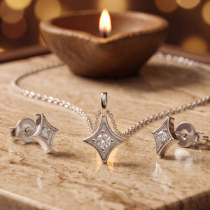 925 silver four-point star pendant and matching stud earrings set, beside a lit diya - jewellery sets category
