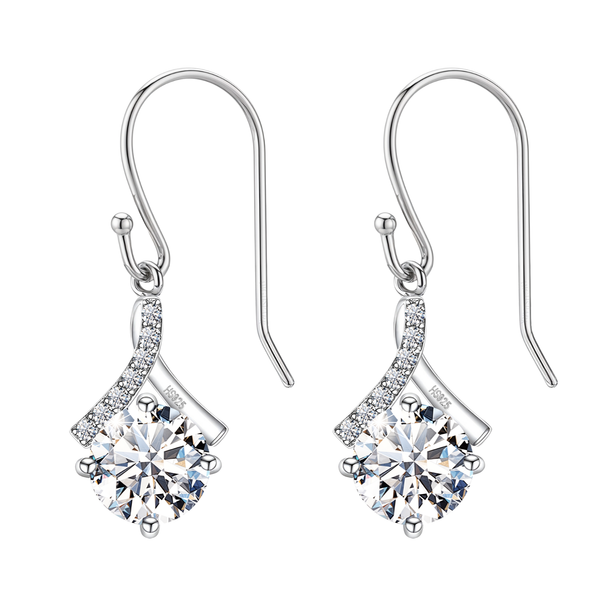 Sterling silver dangle earrings with a round solitaire American diamond in a four-prong setting and a pavé-set ribbon bail on a plain white.