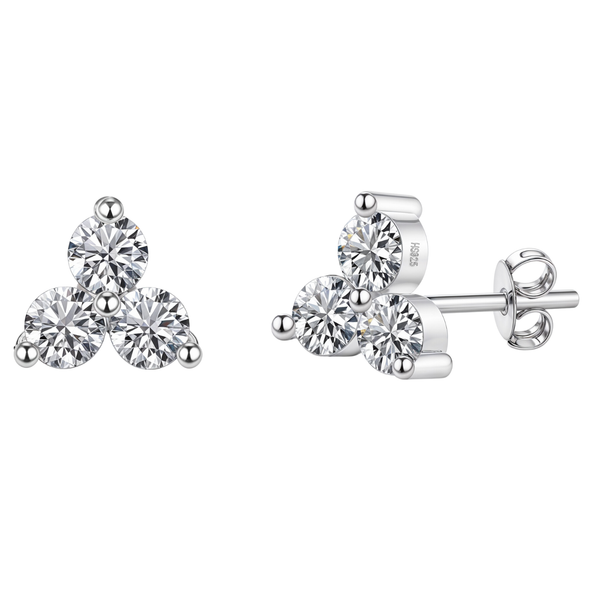A pair of sterling silver stud earrings with a trefoil cluster of three round American diamonds in a prong setting on a white background.