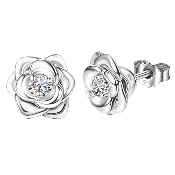 A pair of sterling silver stud earrings shaped like roses with a central round American diamond in a four-prong setting on a white.