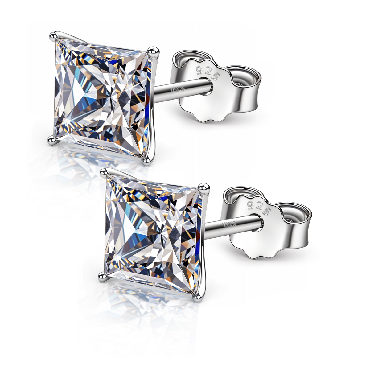 A pair of stud earrings with princess-cut American diamonds in a four-prong martini setting, made of sterling silver on a white background.