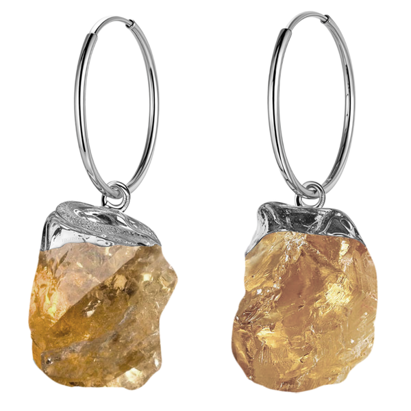 Sterling silver hoop earrings with a dangling raw, rough-cut yellow citrine gemstone in a silver cap setting, on a white background.