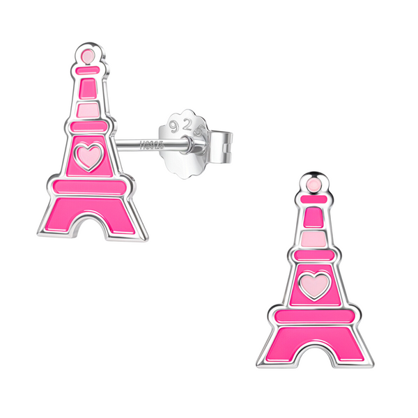 A pair of Eiffel Tower stud earrings with pink enamel detailing and a heart motif, crafted in sterling silver on a white background.