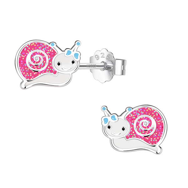A pair of sterling silver stud earrings shaped like snails with pink glitter enamel shells, white bodies, and a light blue bow.