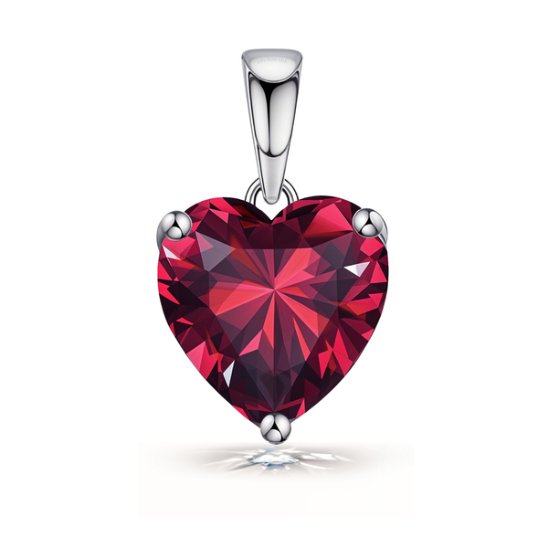 A solitaire pendant featuring a large, heart-shaped red gemstone in a three-prong setting with a polished sterling silver bail.