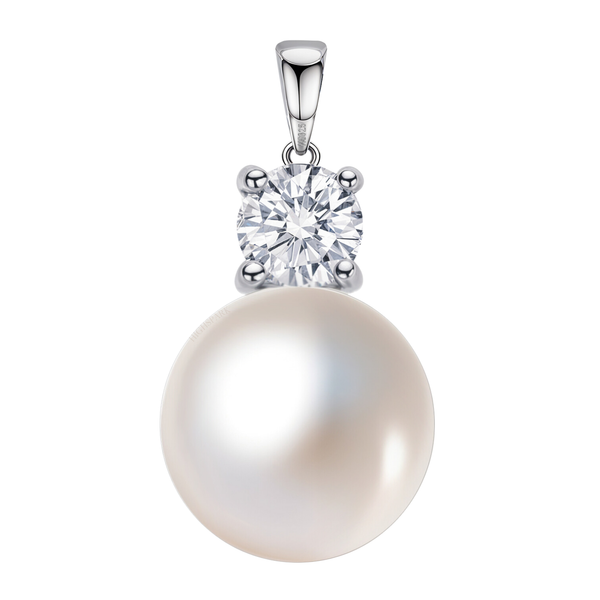 A solitaire pendant with a large white pearl hanging from a round American diamond in a four-prong setting, crafted in sterling silver.