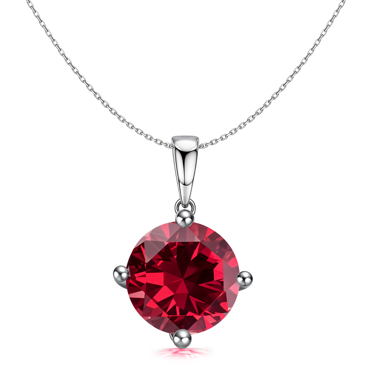 A sterling silver pendant necklace with a large, round-cut ruby-red stone held in a four-prong setting on a plain white background.