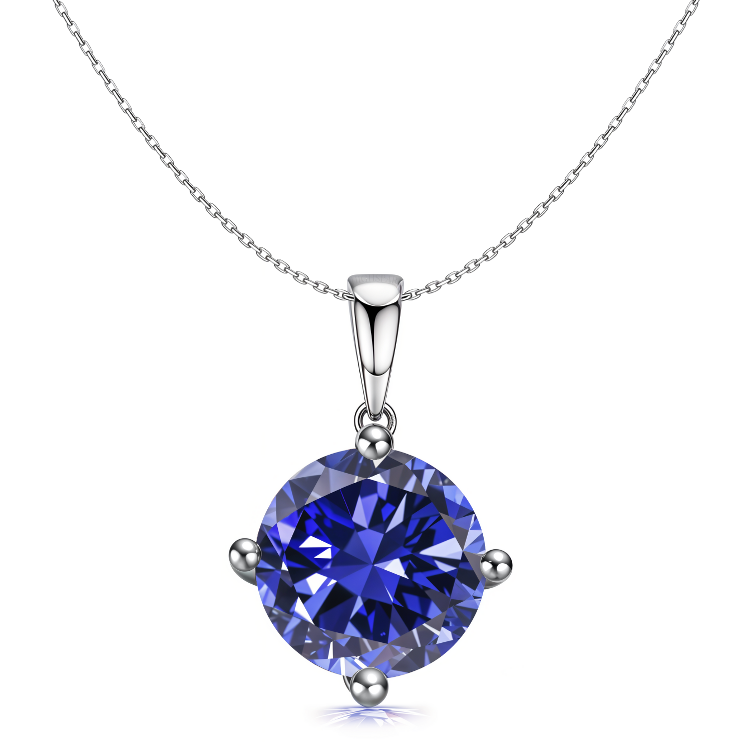 A sterling silver pendant necklace with a round, brilliant-cut tanzanite blue stone in a four-prong setting on a plain white background.
