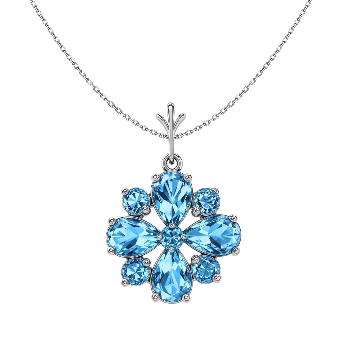 A sterling silver pendant necklace with a snowflake-shaped cluster of pear and round-cut blue stones on a plain white background.