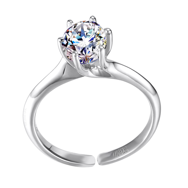 An adjustable solitaire ring with a round American diamond in a six-prong setting on a sterling silver band, shown on a white background.