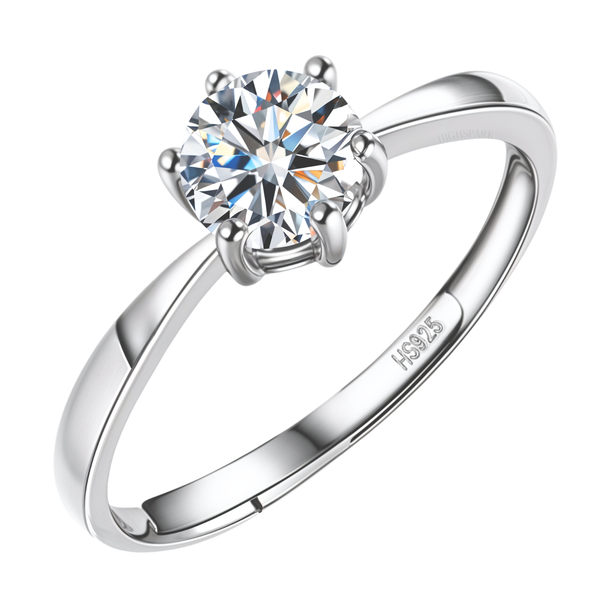 An adjustable solitaire ring with a round-cut American diamond in a six-prong setting on a polished sterling silver band.