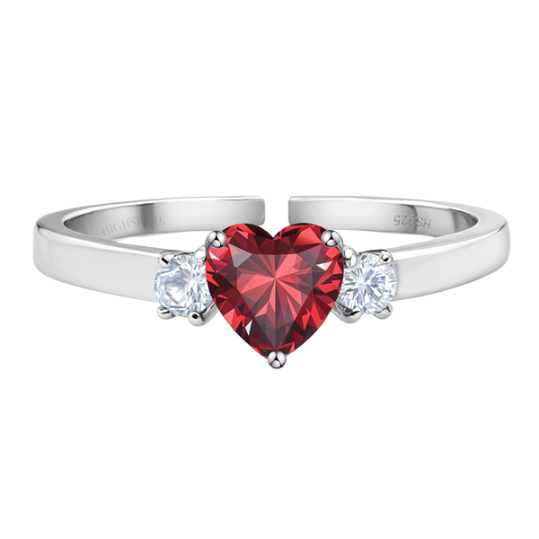 An adjustable sterling silver ring with a central heart-shaped red stone flanked by two round American diamonds on a plain white background.