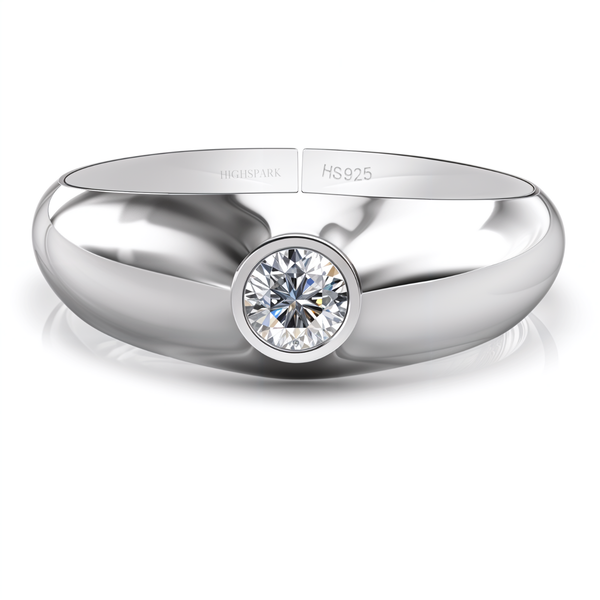 A sterling silver ring with a thick, polished band featuring a single round American diamond in a bezel setting on a white background.