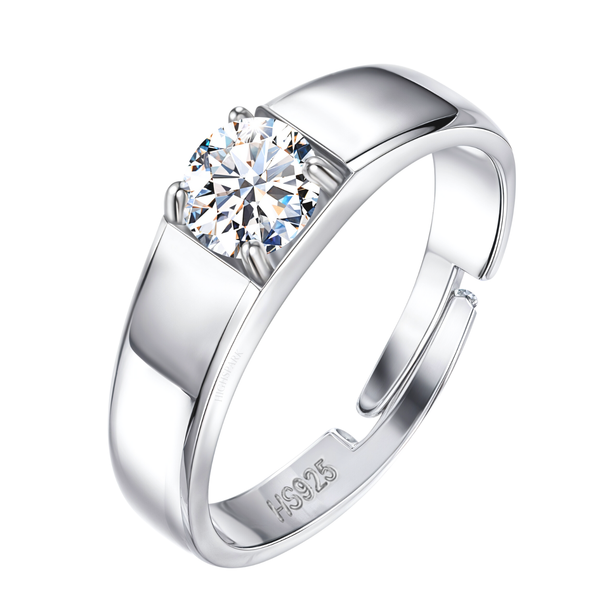 An adjustable sterling silver ring for boys features a brilliant round American diamond held in a four-prong setting on a wide band.