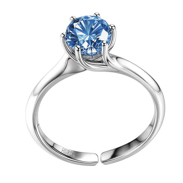An adjustable solitaire ring with a round-cut blue sapphire American Diamond in a six-prong setting on a sterling silver band.