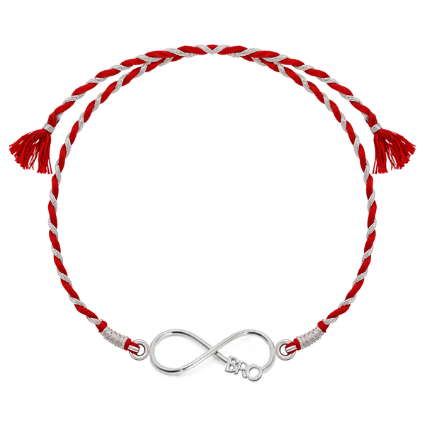 A 925 sterling silver rakhi for brother with an infinity knot centerpiece featuring the word 'BRO' on a red and silver braided thread.