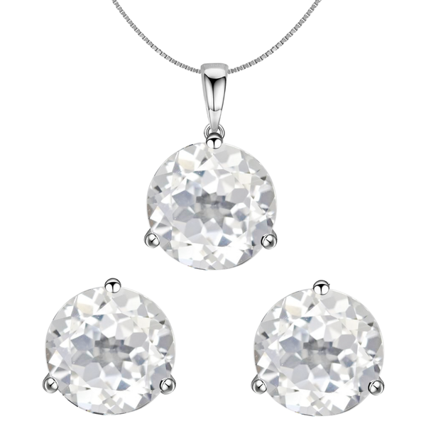 A sterling silver pendant necklace and matching stud earrings set with large, round, faceted American diamonds in a three-prong setting.