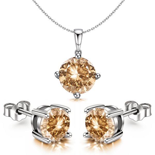 A sterling silver pendant and earring set with round-cut citrine American Diamond stones held in four-prong settings.