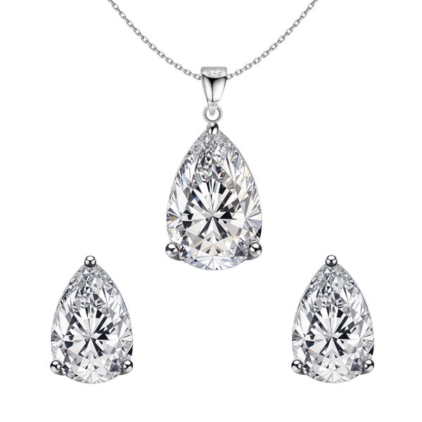 A sterling silver jewellery set with a pear-shaped American diamond pendant necklace and matching three-prong stud earrings on a white.