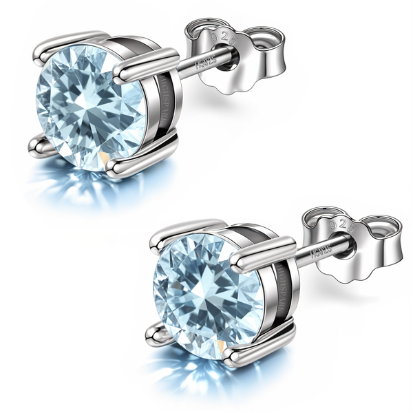 A pair of stud earrings with round, aquamarine-coloured American diamonds in a four-prong setting.