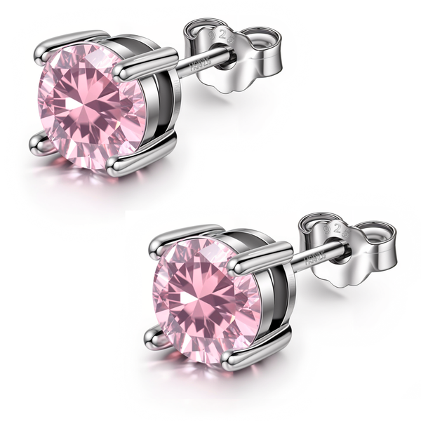 A pair of stud earrings with round, faceted pink tourmaline stones in a four-prong sterling silver setting on a white background.