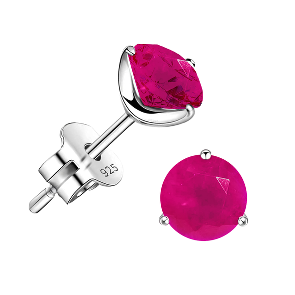 A pair of stud earrings with round, faceted pink jade gemstones in a three-prong sterling silver setting on a white background.