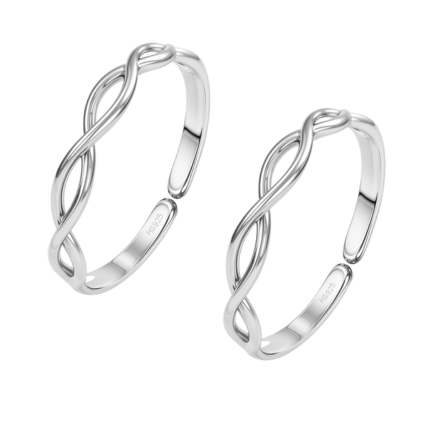 A pair of adjustable toe rings with an intertwined infinity design, crafted in polished sterling silver and shown on a white background.