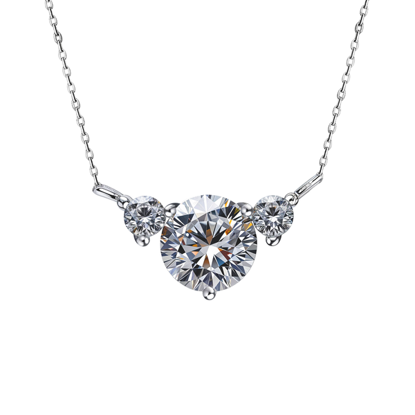 A sterling silver pendant necklace with three round, prong-set American diamonds on a delicate chain, shot on a white background.