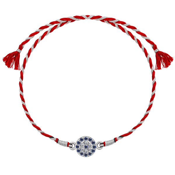 A 925 sterling silver rakhi for brother featuring a round evil eye motif with blue stones and American diamonds on a red and silver thread.