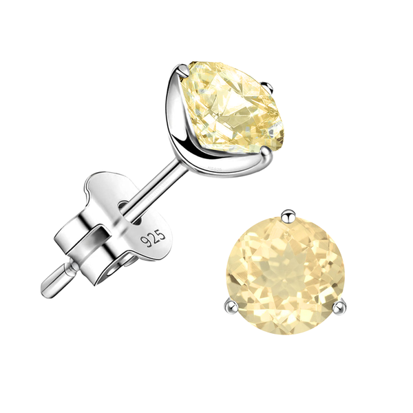A pair of stud earrings with round-cut yellow citrine gemstones in a three-prong sterling silver setting on a white background.