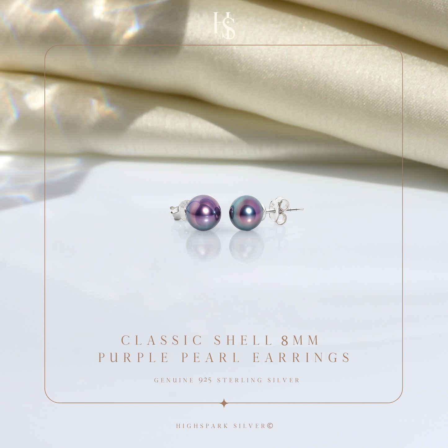 A pair of iridescent purple shell pearl stud earrings in sterling silver.