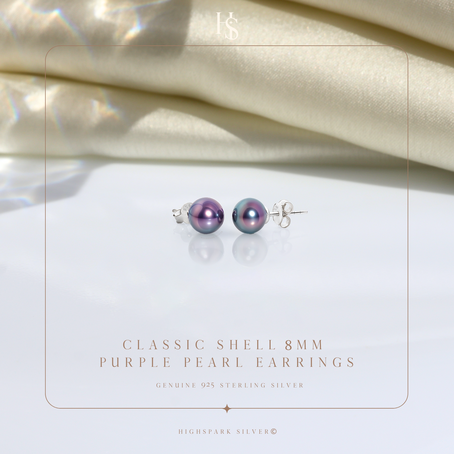 A pair of iridescent purple shell pearl stud earrings in sterling silver.