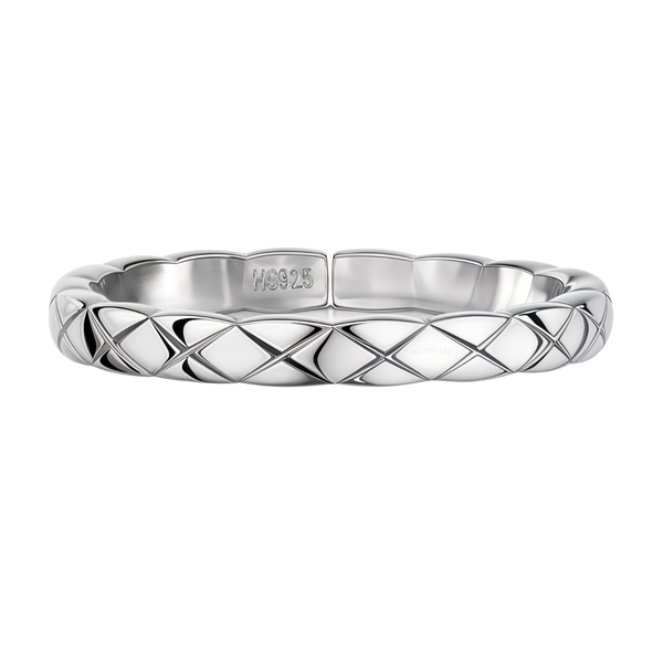 A sterling silver band ring with a quilted, criss-cross pattern and a high-polish finish, shown on a plain white background.