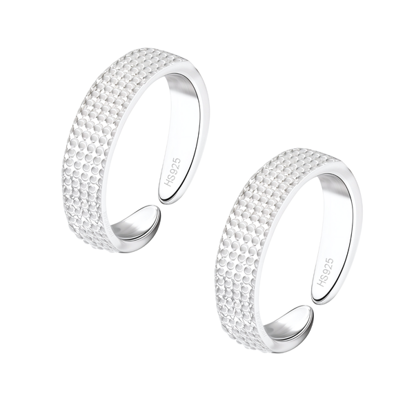 A pair of adjustable sterling silver toe rings with a dotted embossed texture, shown on a plain white background.