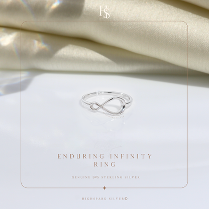 An adjustable sterling silver ring with an infinity symbol motif.