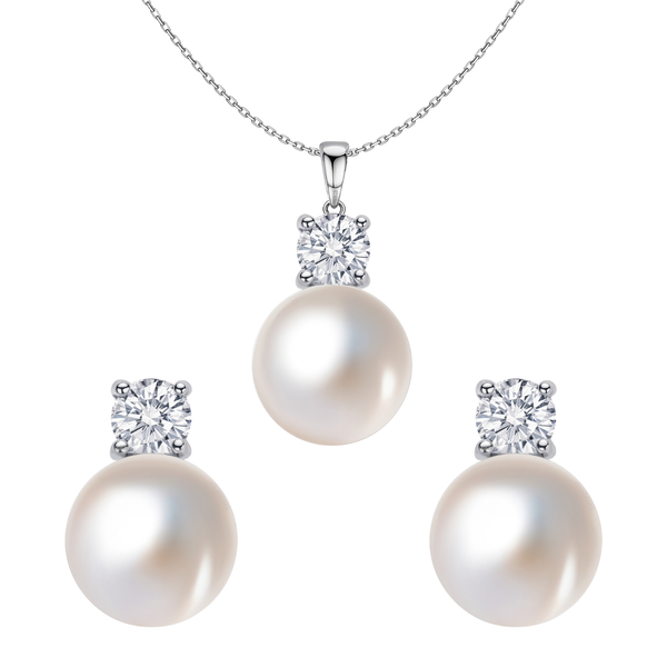 A sterling silver pendant necklace and matching stud earrings set with round pearls and four-prong set American diamonds on a white.
