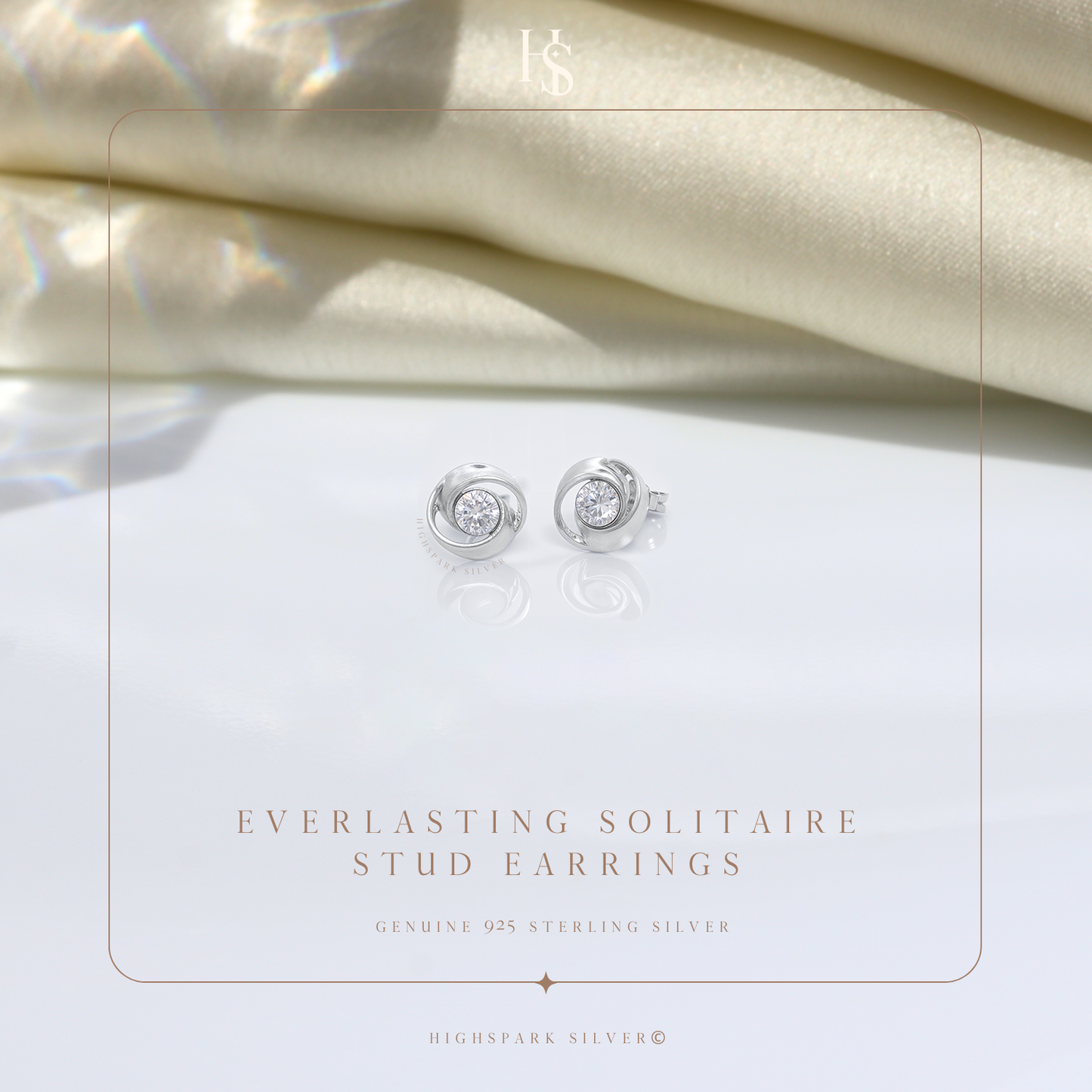 A pair of sterling silver stud earrings with a swirling design holding a central American diamond.