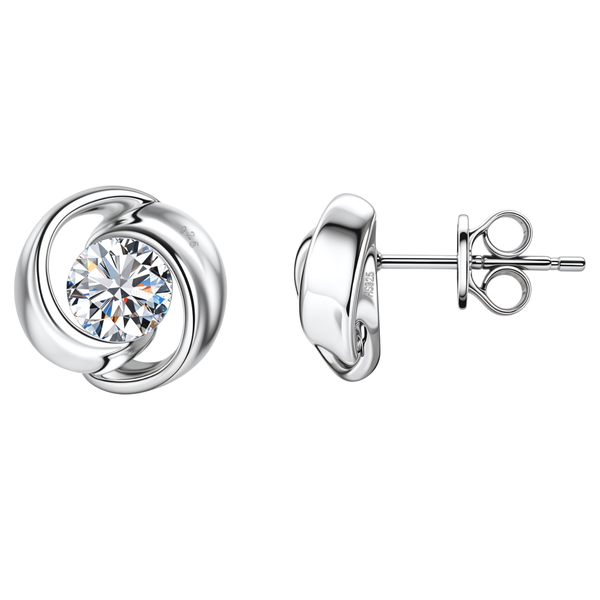 A pair of everlasting stud earrings with a central American diamond in a swirling sterling silver setting, shown on a white background.