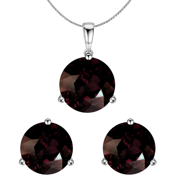 A pendant necklace and matching stud earrings set with large, round, faceted garnet gemstones in a three-prong sterling silver setting.