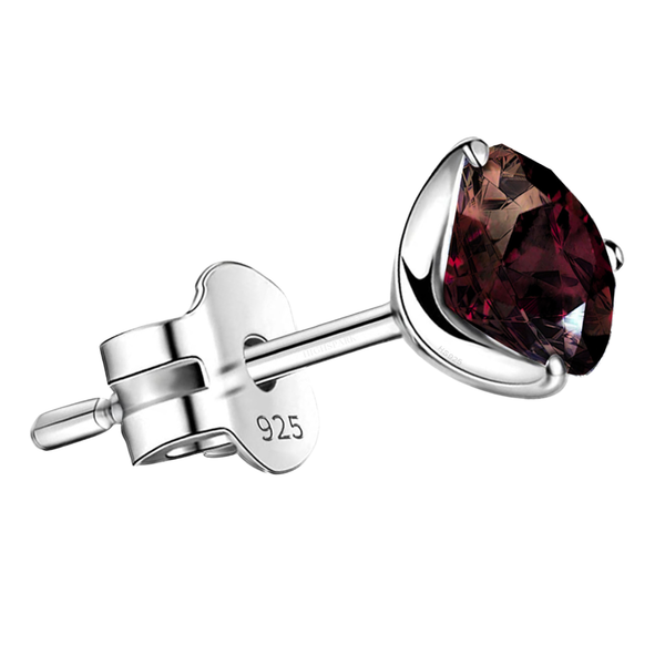 A single men's stud earring features a round-cut garnet gemstone in a three-prong setting.