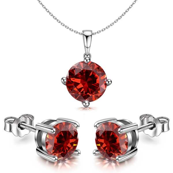 A pendant and stud earring set with round, red garnet-coloured stones in a four-prong setting.