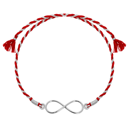 A 925 sterling silver rakhi for a brother featuring an infinity knot centerpiece on a braided red and silver thread.