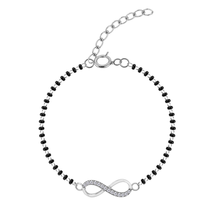 A sterling silver mangalsutra bracelet with an infinity symbol charm, pavé-set with American diamonds, on a white background.