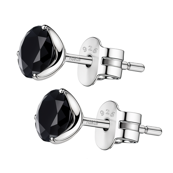 A pair of stud earrings with round, faceted black stones in a three-prong martini setting of 925 sterling silver with push backs.