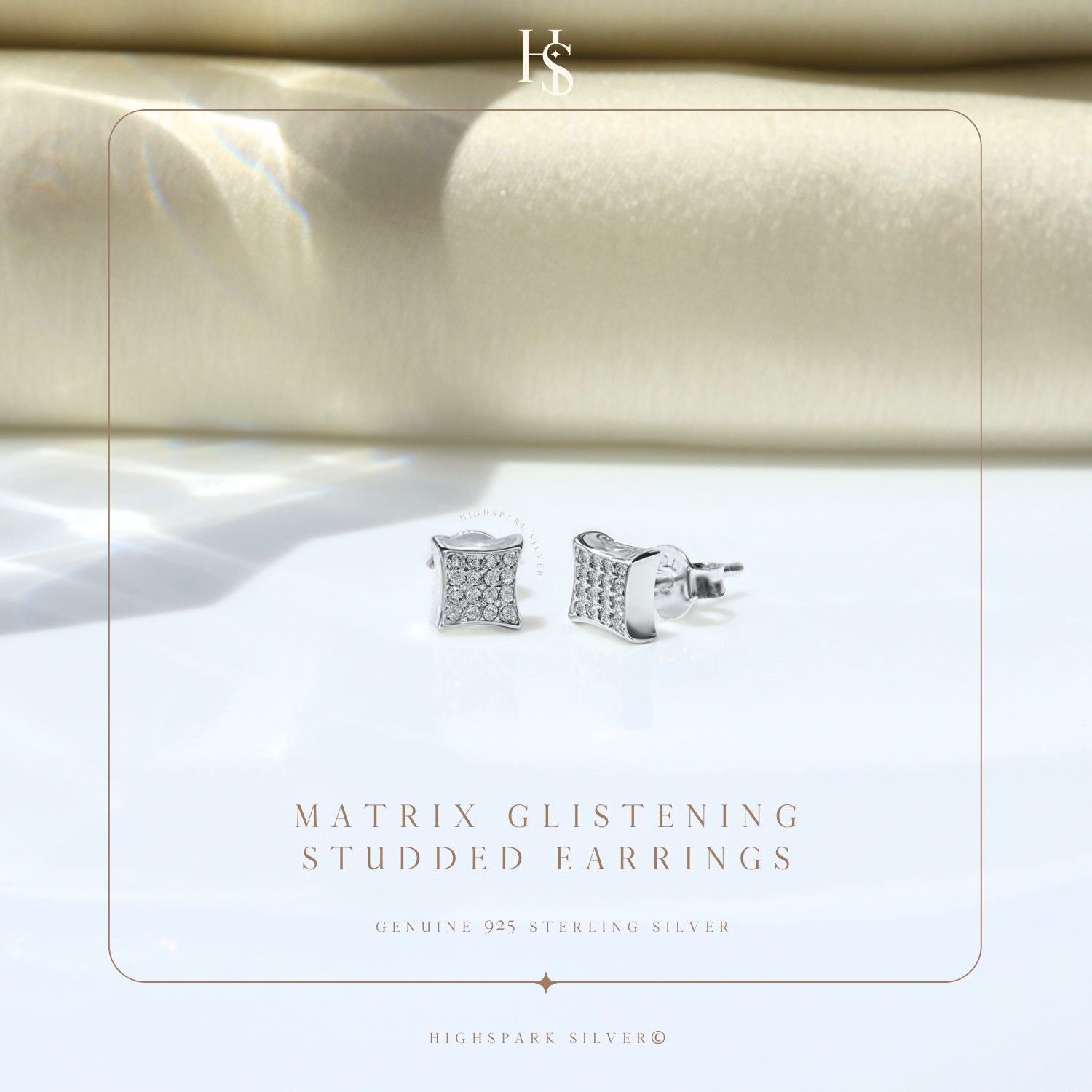 A pair of square stud earrings with pavé-set American diamonds in sterling silver.