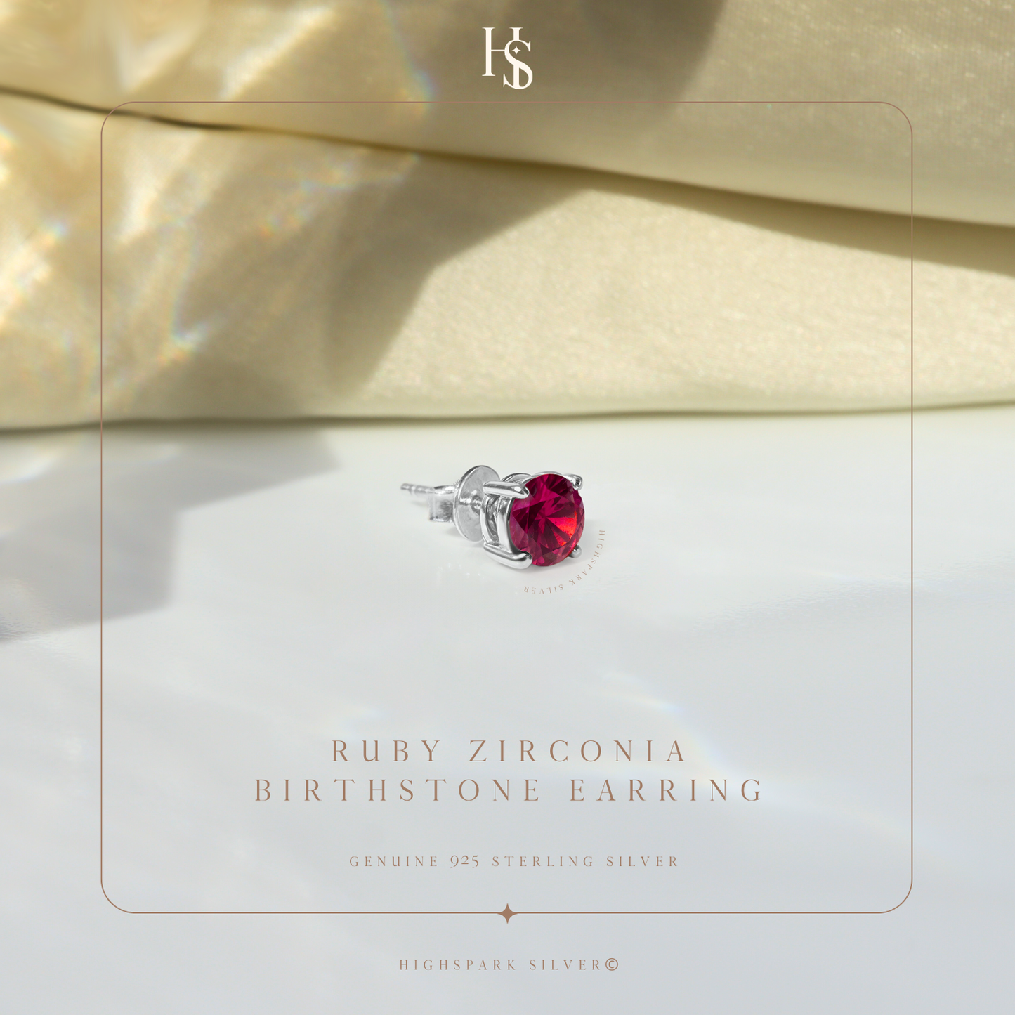 A single sterling silver stud earring with a round ruby American Diamond in a four-prong setting.
