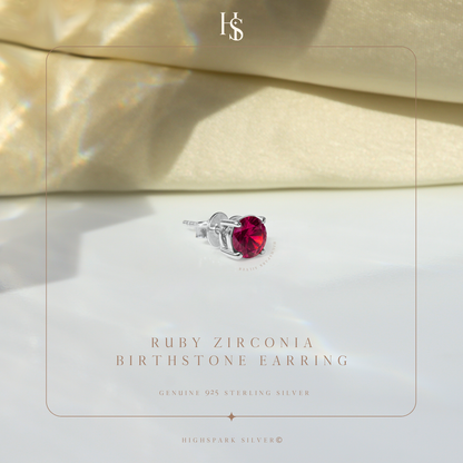 A single sterling silver stud earring with a round ruby American Diamond in a four-prong setting.