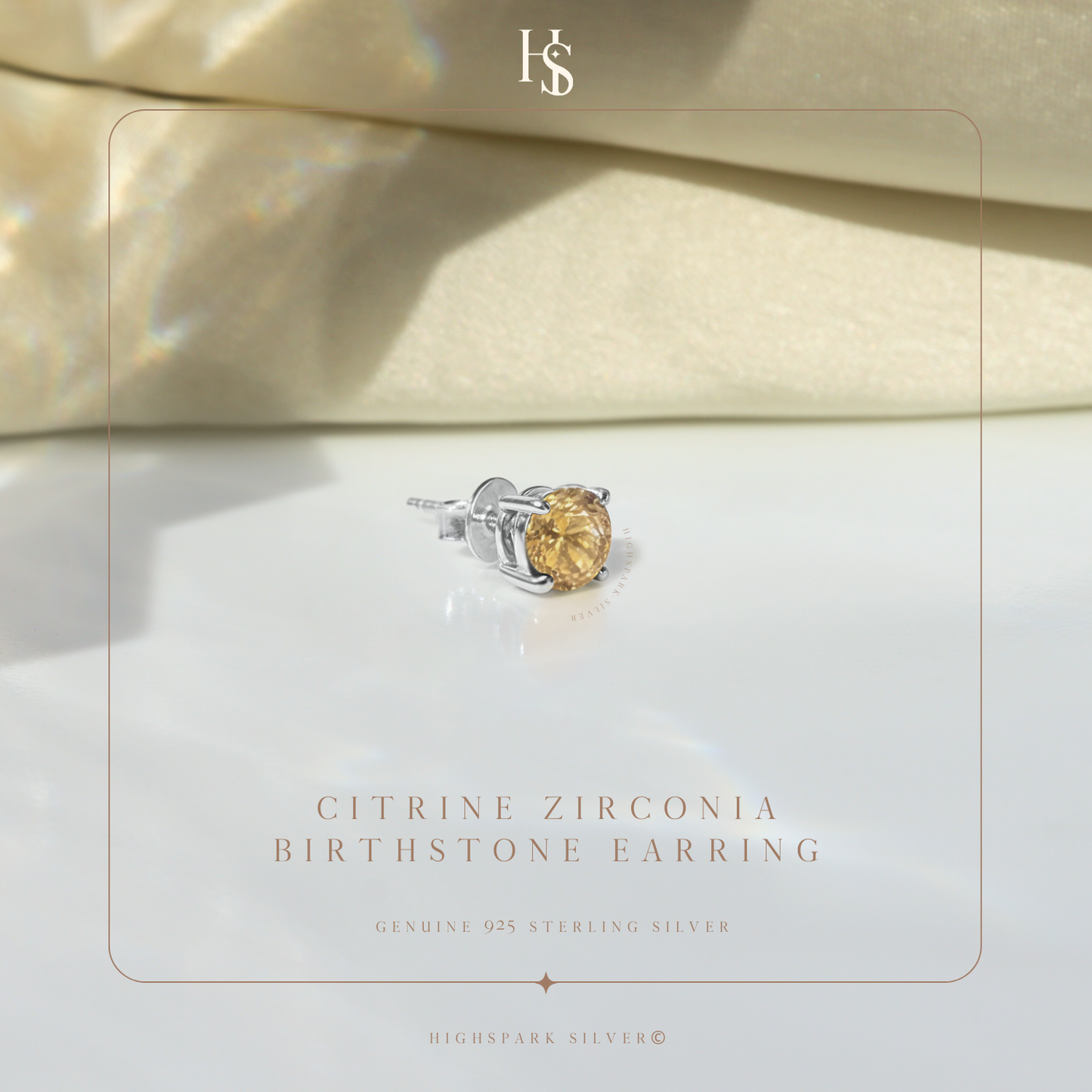A single men's stud earring with a round, citrine-yellow American diamond in a four-prong sterling silver setting.