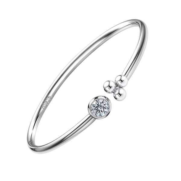 An adjustable sterling silver ring with an open cuff design, featuring a bezel-set American diamond and a cluster of three silver beads.